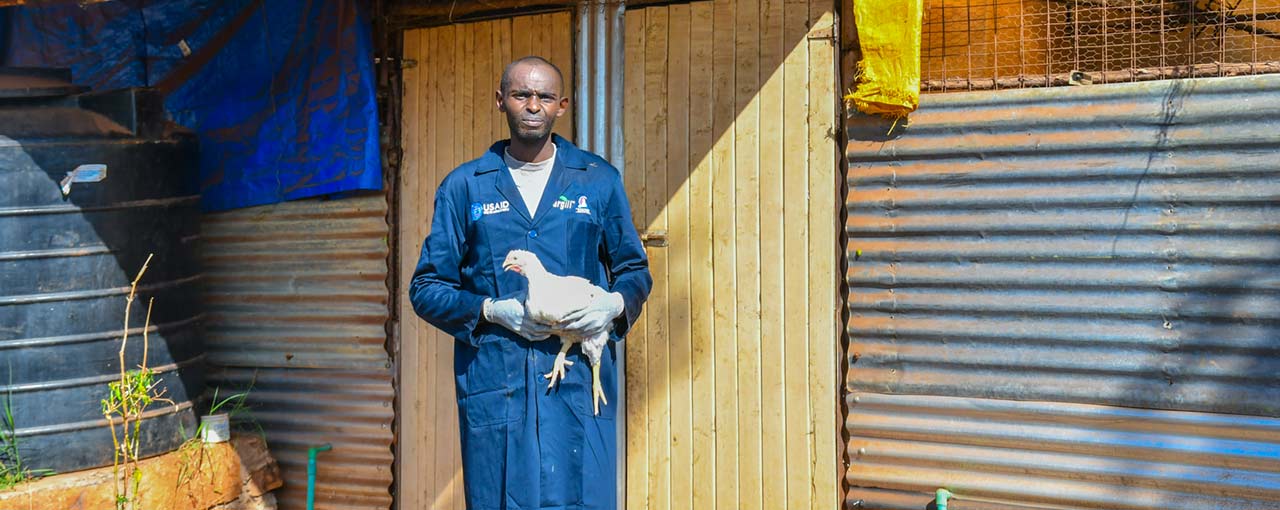 A poultry farmer in Kenya keeps his flock healthier after receiving training from TRANSFORM.  A poultry farmer in Kenya keeps his flock healthier after receiving training from TRANSFORM.